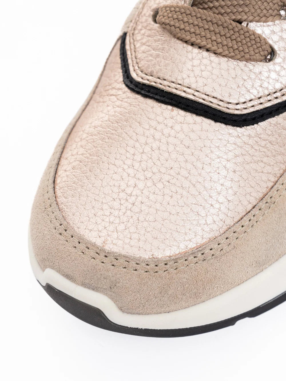 Close-up of a ARA Shoes Nagano Women's Beige and black Sneakers on a light gray background