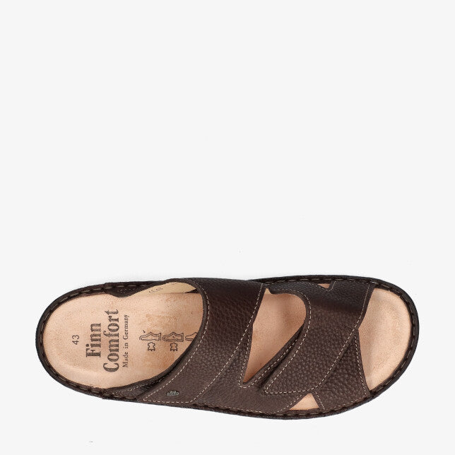 Brown sandal with 'Finn Comfort' branding on a white background