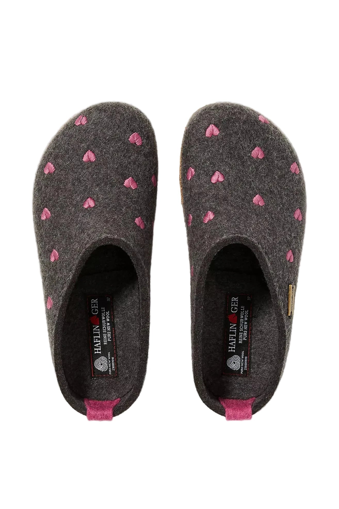 Pair of Haflinger Cuoricini clog dark gray slippers with pink heart patterns on a light gray background
