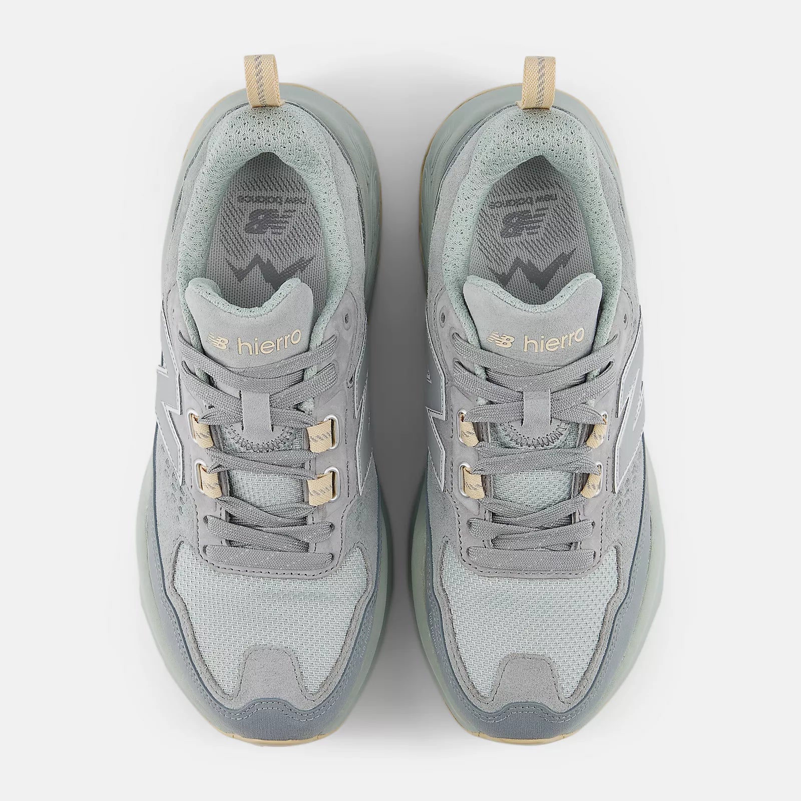 Pair of gray sneakers with gold accents on a white background NEW BALANCE WHIET6QZ Hierro Trek Trail Running Slate Grey Women shoe Foot Sensation Canada Online Store in-store Toronto Mississauga Vancouver Montreal Ottawa Quebec Calgary Edmonton Winnipeg
