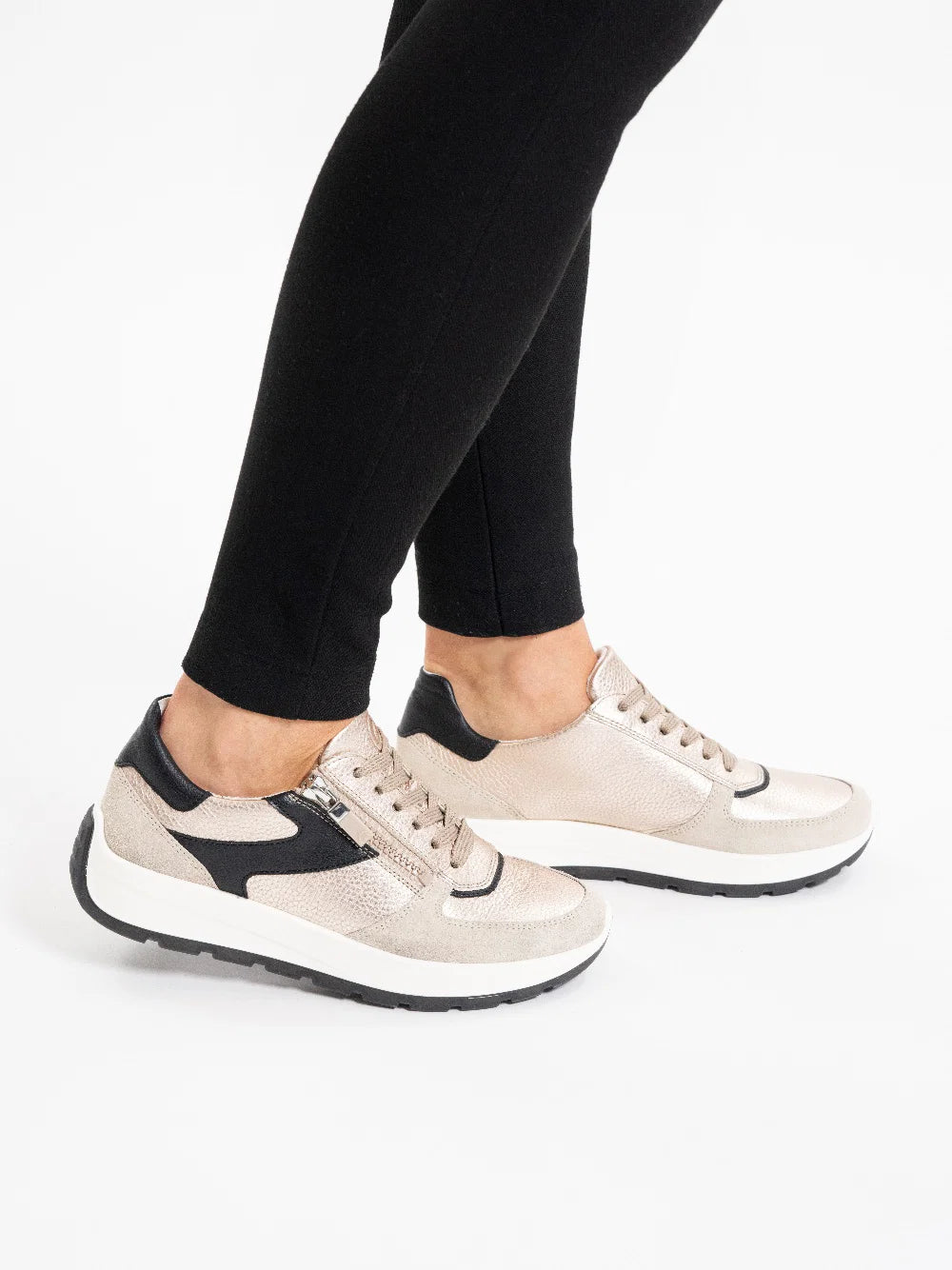 ARA Shoes Nagano Women's Beige and black Sneakers worn by model with black leggings on a white background
