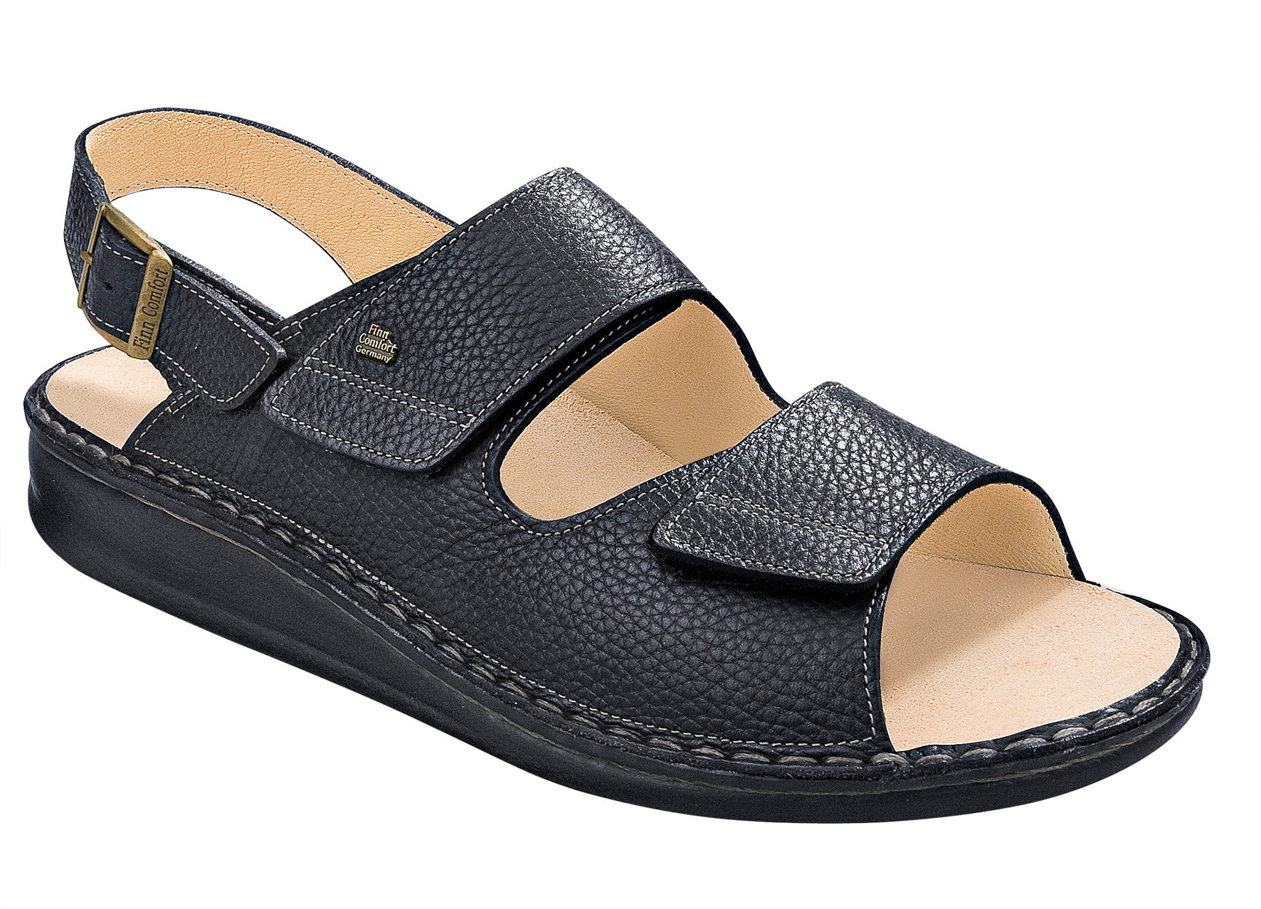 Black sandal with a beige interior on a white background