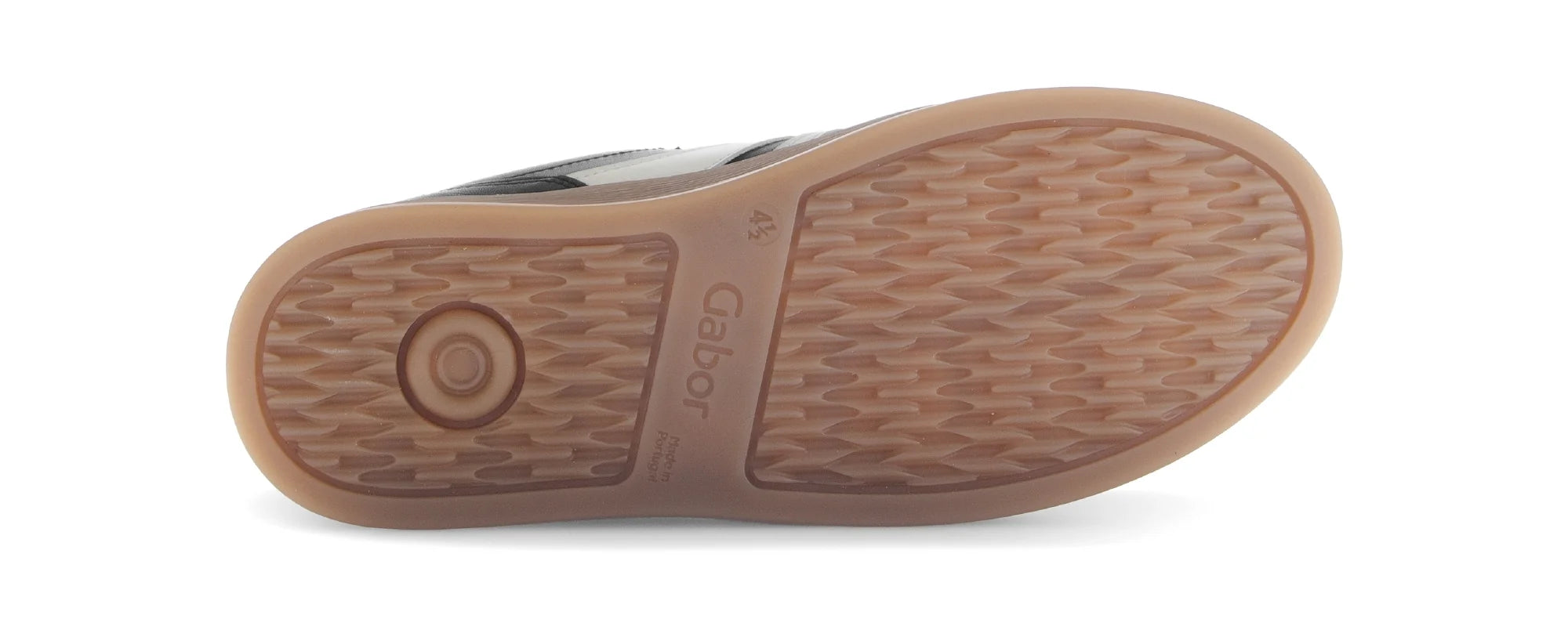 Close-up of a brown sole with a textured pattern on a white background
