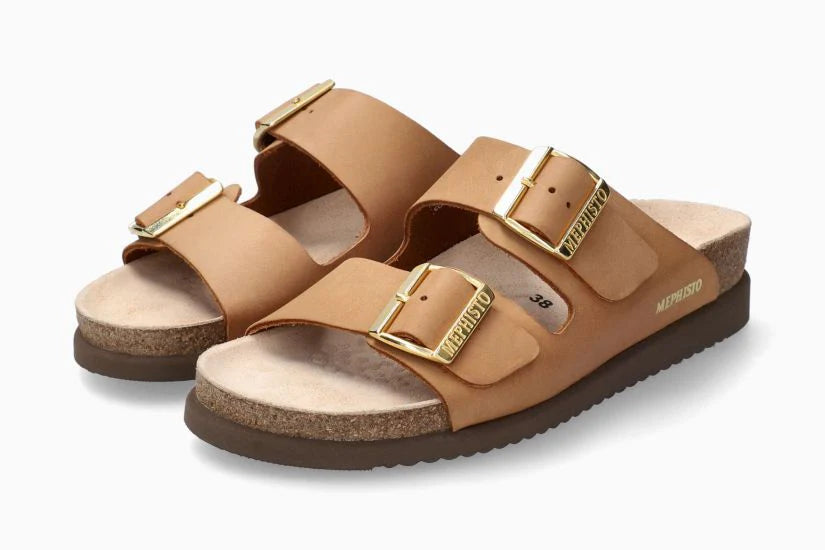 Pair of tan sandals with gold buckles on a white background