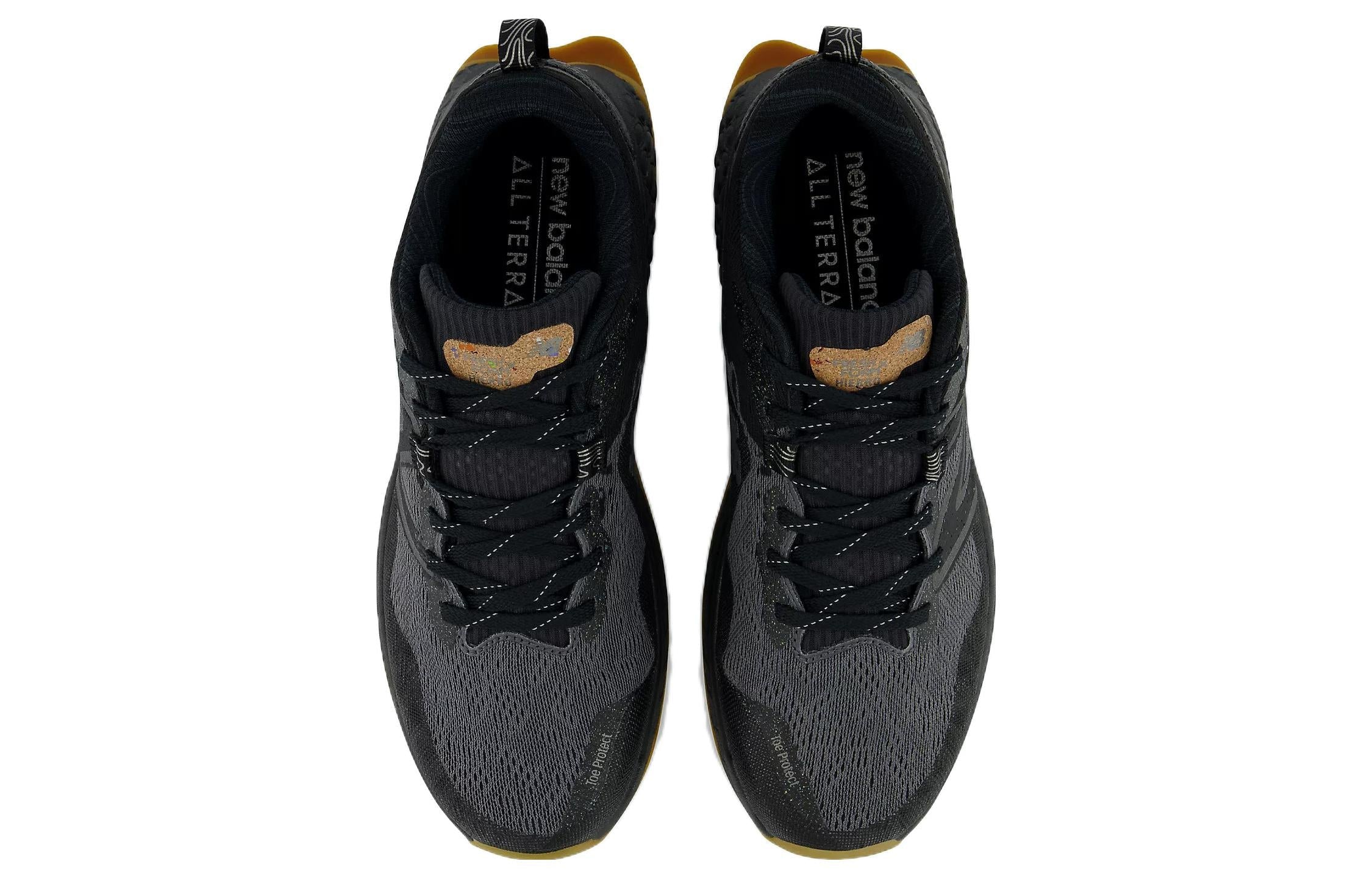 Black athletic shoes NEW BALANCE branding on a white background