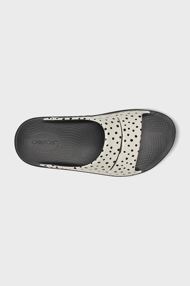 OOFOS logo OOahh Women's Slide Sandal Pebble on a white background